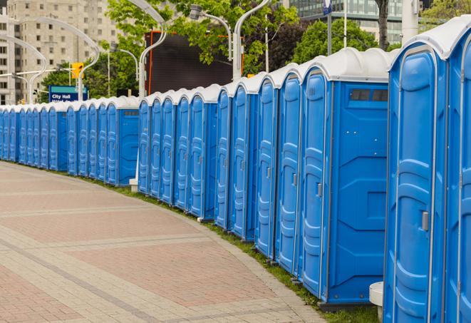 a line of portable restrooms at an outdoor wedding, catering to guests with style and comfort in Apopka